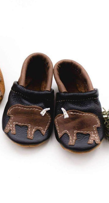 Bison on Black Leather Shoes